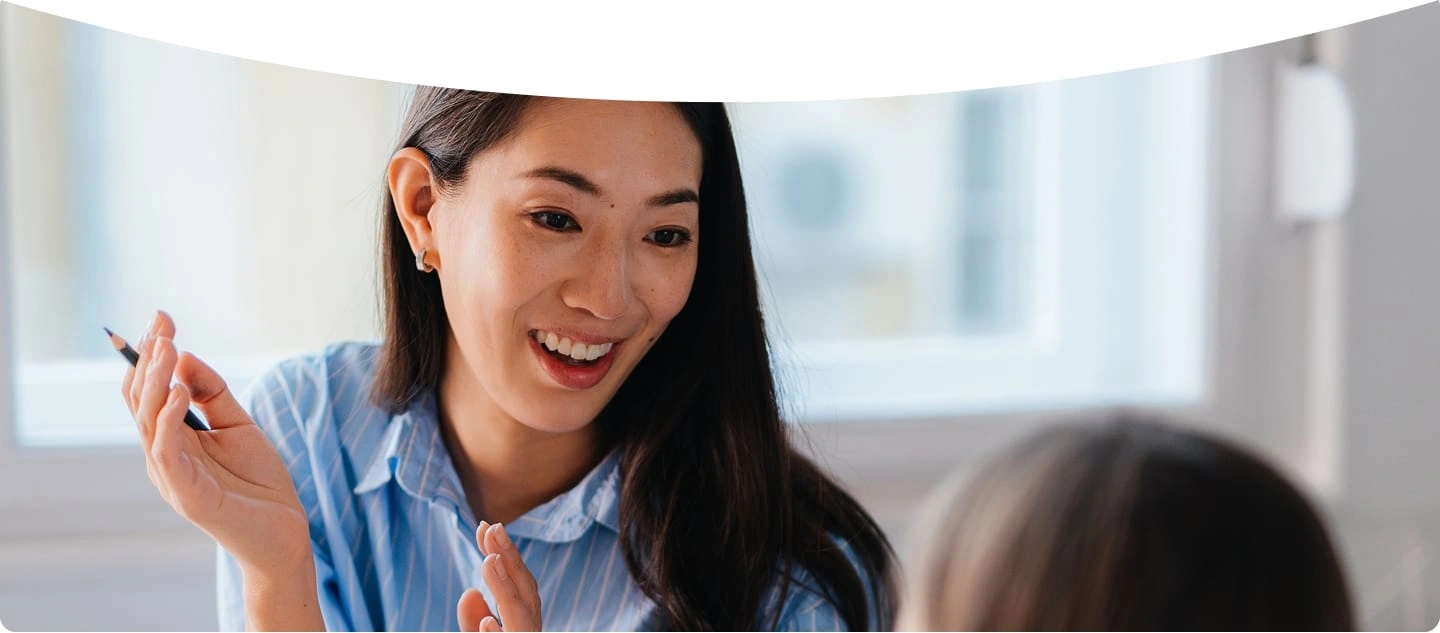 An image of a smiling speech-language pathologist.