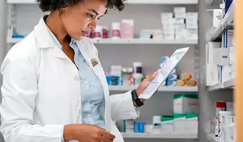 A pharmacist speaking with a patient