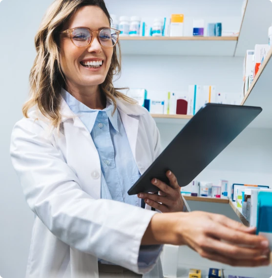 A healthcare professional reviewing paperwork on a clipboard.