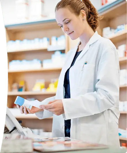 Pharmacist reviewing medication in a pharmacy