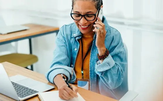 School professional on a call at her desk